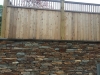 Stone Masonry Wall with wood privacy fence